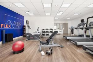 a gym with exercise equipment and a sign that says go ahead flex a line at Holiday Inn Express Las Vegas Stadium Area, an IHG Hotel in Las Vegas