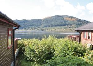 a view of a lake from a house at Bassenthwaite Lakeside Lodges in Bassenthwaite