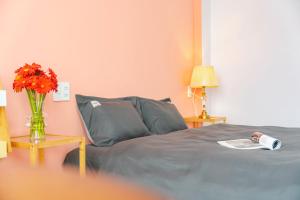 Postel nebo postele na pokoji v ubytování Kim Little Hotel Dalat