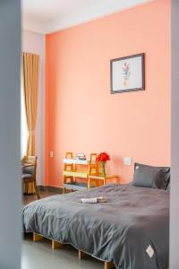 Postel nebo postele na pokoji v ubytování Kim Little Hotel Dalat