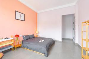 Postel nebo postele na pokoji v ubytování Kim Little Hotel Dalat