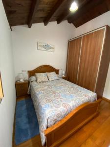 Tempat tidur dalam kamar di Casa Paquita 1