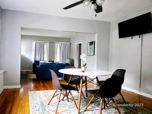 a living room with a table and chairs at Perfect! near CLE Clinic/Case/UH/Downtown! in Cleveland
