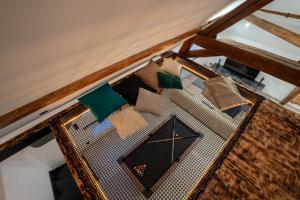 an overhead view of a table with pillows on it at Le Saint-André - Clim - Loft romantique avec Jacuzzi - By Primo in Buxy