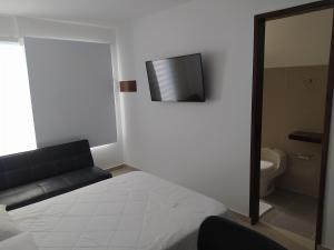 Llit o llits en una habitació de Apartaestudio 201 - Casa Hotel Anita