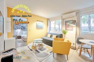 a living room with a couch and a table at Ô Repos des Artistes - Classified apartments*** in Toulon