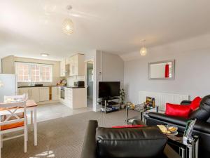 a living room with a couch and a table at 1 bed in Cinderford 88271 in Cinderford