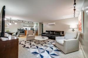 a living room with a couch and a table at Nashville Riverfront Lofts in Nashville