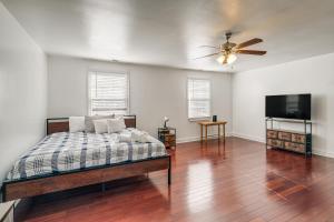 a bedroom with a bed and a flat screen tv at Pet-Friendly Silver Spring Home 2 Mi to Downtown! in Silver Spring
