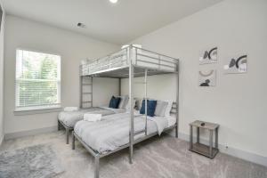 a bedroom with two beds and a bunk bed at Shades of Grey in Houston