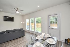 a living room with a couch and a table at Shades of Grey in Houston