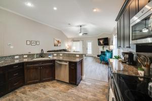 a kitchen with a sink and a counter top at Saginaw Home with Fenced Yard 11 Mi to Fort Worth! in Saginaw
