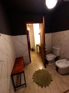 a bathroom with a toilet and a sink at Balcones de playa de oro in Villa Independencia