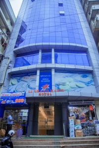 a building with a sign on the side of it at LE GRAND MARIE HOTEL in Dar es Salaam