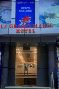 a building with a sign for thele grand market hotel at LE GRAND MARIE HOTEL in Dar es Salaam