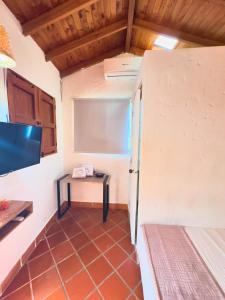 Ένα ή περισσότερα κρεβάτια σε δωμάτιο στο Encomendero Hotel -Centro Histórico-