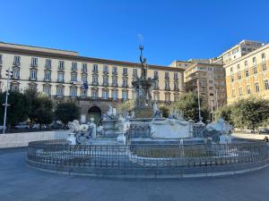 a fountain in front of a large building at Naples Soul - city center in Naples