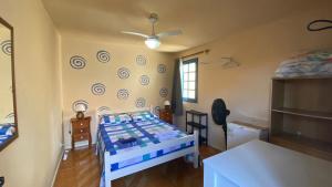 En eller flere senge i et værelse på Suítes no Centro