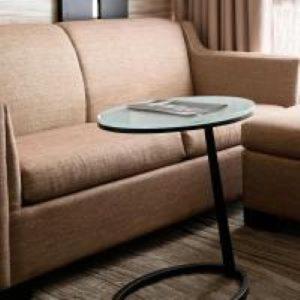 a coffee table in front of a couch with a table at Lincolnshire Marriott Resort in Lincolnshire