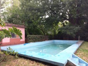 a swimming pool in the yard of a house at Quinta Don Diego in Piñero