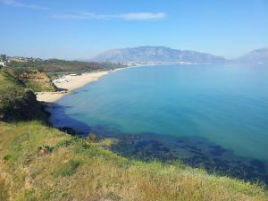 an aerial view of a beach with mountains in the background at Dall'Orso Grigio in Balestrate