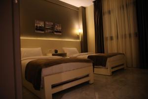 Postel nebo postele na pokoji v ubytování Regal view Aparthotel