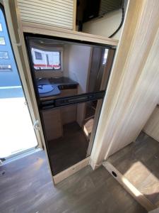 TV a/nebo společenská místnost v ubytování Autocamper