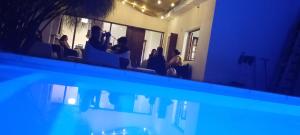 a group of people sitting in chairs in a room at Güemes Hostel Cordoba in Cordoba