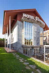 a hotel with a sign on the front of it at Hotel Verdemar in Ribadesella