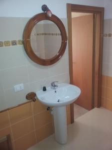 a bathroom with a sink and a mirror at Dall'Orso Grigio in Balestrate