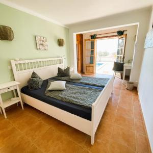 Postel nebo postele na pokoji v ubytování Agroturismo S Hort de Can Carrio AG226