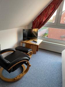 Μια τηλεόραση ή/και κέντρο ψυχαγωγίας στο Ferienhaus Brandes Wohnung 4