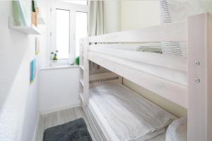 Postel nebo postele na pokoji v ubytování Norderney Sandkorn