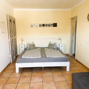 a bedroom with a large bed in a room at S´Hort de Can Carrió in Ses Salines