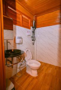 a bathroom with a toilet and a glass table at Song Lay Resort, Koh Mook, Trang THAILAND in Koh Mook +68 photos