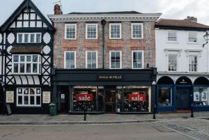 a store front with a sale sign in front of a building at Swan's Nest in Henley on Thames