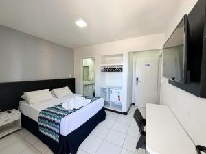Postel nebo postele na pokoji v ubytování Ritz Praia Hotel + 22 fotografií