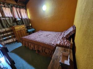 En eller flere senge i et værelse på Las Toninas Duplex 5