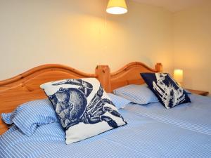 a bed with two pillows on top of it at 3 Bed in Bude PORTH in Morwenstow