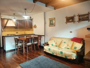 a living room with a couch and a table at Matese Home in San Massimo