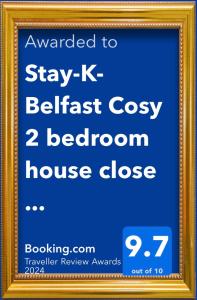 a sign in a gold frame with the text wanted to stay belfast cozy at Stay-K-Belfast Cosy house 10 mins from city centre in Belfast