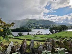 a view of a large body of water and a mountain at Grasmere View Grasmere in Grasmere