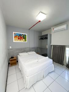 Postel nebo postele na pokoji v ubytování Ritz Praia Hotel