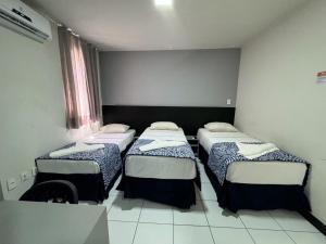 Postel nebo postele na pokoji v ubytování Ritz Praia Hotel
