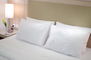 Posteľ alebo postele v izbe v ubytovaní Toledo Amman Hotel