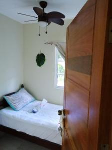 A bed or beds in a room at Apto en Loma de Cabrera, Dajabon.