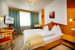 Postel nebo postele na pokoji v ubytování Der Thaller - Wirtshaus - Restaurant - Hotel