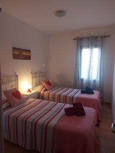 Postel nebo postele na pokoji v ubytování villa Mimosa + 37 fotografií