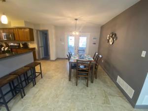 a kitchen and dining room with a table and chairs at Close to beaches Pet friendly heated pool hot tub in Largo