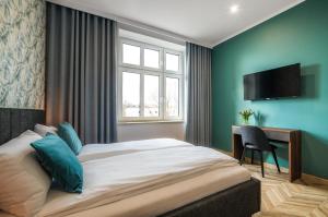 Postel nebo postele na pokoji v ubytování Flats4Rent Piłsudskiego 6 + 3 fotografie